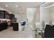 Modern kitchen with dark cabinets and granite countertops at 4428 Kaipo Rd, Davenport, FL 33897