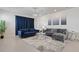Relaxing living room with sectional sofa and area rug at 4428 Kaipo Rd, Davenport, FL 33897