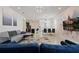 Open concept living area with modern furniture and large TV at 4428 Kaipo Rd, Davenport, FL 33897