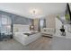 Main bedroom with a king-size bed, crib, and ample closet space at 4428 Kaipo Rd, Davenport, FL 33897