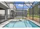 Enjoy this relaxing pool and spa area with screened enclosure at 4428 Kaipo Rd, Davenport, FL 33897