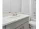 Clean bathroom with gray vanity, white countertop and oval sink at 5286 Tuscany Ln, Davenport, FL 33897