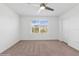 Well-lit bedroom with ceiling fan and window at 5286 Tuscany Ln, Davenport, FL 33897