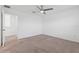 Bedroom with ceiling fan and access to another room at 5286 Tuscany Ln, Davenport, FL 33897