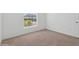 Bright bedroom featuring neutral wall paint and carpeted floors at 5286 Tuscany Ln, Davenport, FL 33897