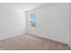 Bright bedroom with neutral carpeting and a window with blinds at 5286 Tuscany Ln, Davenport, FL 33897
