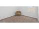 Bedroom with carpeted floor, window, and comfy chair at 5286 Tuscany Ln, Davenport, FL 33897