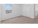Simple bedroom with neutral carpet and a double door closet at 5286 Tuscany Ln, Davenport, FL 33897