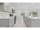 Modern kitchen with gray cabinets and quartz countertops at 5286 Tuscany Ln, Davenport, FL 33897