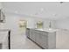Modern kitchen with gray cabinets, white countertops, and stainless steel appliances at 5286 Tuscany Ln, Davenport, FL 33897