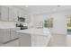Modern kitchen with gray cabinets and quartz countertops at 5286 Tuscany Ln, Davenport, FL 33897