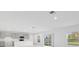 Modern kitchen with gray cabinets, island, and stainless steel appliances at 5286 Tuscany Ln, Davenport, FL 33897