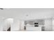 Modern kitchen with gray cabinets, island, and stainless steel appliances at 5286 Tuscany Ln, Davenport, FL 33897