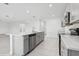 Modern kitchen island with gray cabinets and white countertops at 5286 Tuscany Ln, Davenport, FL 33897