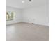 Bright living room with tile floors and large window at 5286 Tuscany Ln, Davenport, FL 33897