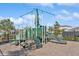 Green playground with slides and climbing wall at 5286 Tuscany Ln, Davenport, FL 33897