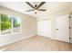 Spacious bedroom with ceiling fan and window overlooking trees at 539 Heatherton Vlg, Altamonte Springs, FL 32714