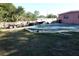 Large backyard with an inground pool and boat trailer at 6119 Bolling Dr, Orlando, FL 32808