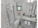 Bathroom with gray vanity and walk-in shower at 6133 High Seas Dr, Orlando, FL 32821