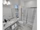 Modern bathroom with gray vanity, shower, and tiled floor at 6133 High Seas Dr, Orlando, FL 32821