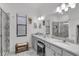 Modern bathroom with gray marble tile and double vanity at 6133 High Seas Dr, Orlando, FL 32821