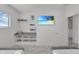 Bedroom with built-in shelving and TV at 6133 High Seas Dr, Orlando, FL 32821