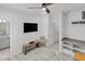 Bright bonus room features built-in shelving and a TV area at 6133 High Seas Dr, Orlando, FL 32821