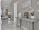 Bright entryway with gray console table and decor at 6133 High Seas Dr, Orlando, FL 32821