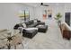 Open living space with sectional sofa and glass dining table at 6133 High Seas Dr, Orlando, FL 32821