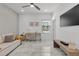 Home office with sofa, desk, and built-in shelving at 6133 High Seas Dr, Orlando, FL 32821