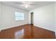 Bright bedroom featuring wood-look tile flooring and a spacious closet at 705 Beverly Ave, Altamonte Springs, FL 32701