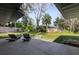 Large backyard with lawn and lounge chairs at 8 Pine Ct, Yalaha, FL 34797
