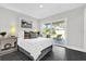 Bright bedroom with sliding glass doors opening to the backyard at 8 Pine Ct, Yalaha, FL 34797