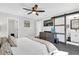 Bright bedroom with ensuite bathroom access and a comfortable bed at 8 Pine Ct, Yalaha, FL 34797