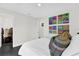 Spacious bedroom with unique wall art and an adjoining room at 8 Pine Ct, Yalaha, FL 34797