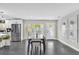Modern dining room with sliding glass doors at 8 Pine Ct, Yalaha, FL 34797