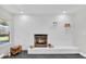 Modern white brick fireplace with wood storage at 8 Pine Ct, Yalaha, FL 34797