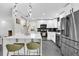 Modern kitchen with stainless steel appliances and an island at 8 Pine Ct, Yalaha, FL 34797