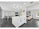 Modern kitchen with white cabinets and island at 8 Pine Ct, Yalaha, FL 34797