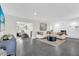 Spacious living room with fireplace and large windows at 8 Pine Ct, Yalaha, FL 34797
