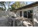 Outdoor patio with seating area and access to interior at 8 Pine Ct, Yalaha, FL 34797