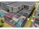 Aerial view of house with private pool and screened enclosure at 8940 Play Through Dr, Davenport, FL 33896