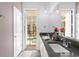 Modern bathroom with double vanity and pool view at 8940 Play Through Dr, Davenport, FL 33896