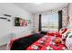 Mickey Mouse themed bedroom with twin beds and a TV at 8940 Play Through Dr, Davenport, FL 33896