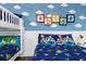 Toy Story themed bedroom with bunk beds and full bed at 8940 Play Through Dr, Davenport, FL 33896