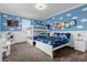 Toy Story themed bedroom with bunk beds and full bed at 8940 Play Through Dr, Davenport, FL 33896