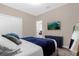 Comfortable bedroom with a TV and a full-length mirror at 8940 Play Through Dr, Davenport, FL 33896