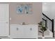 Bright entryway with built-in storage and contemporary art at 8940 Play Through Dr, Davenport, FL 33896