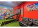 Fun game room with air hockey, foosball, and basketball game at 8940 Play Through Dr, Davenport, FL 33896