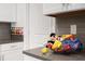 Kitchen counter with fun Mickey Mouse themed snacks and toys at 8940 Play Through Dr, Davenport, FL 33896